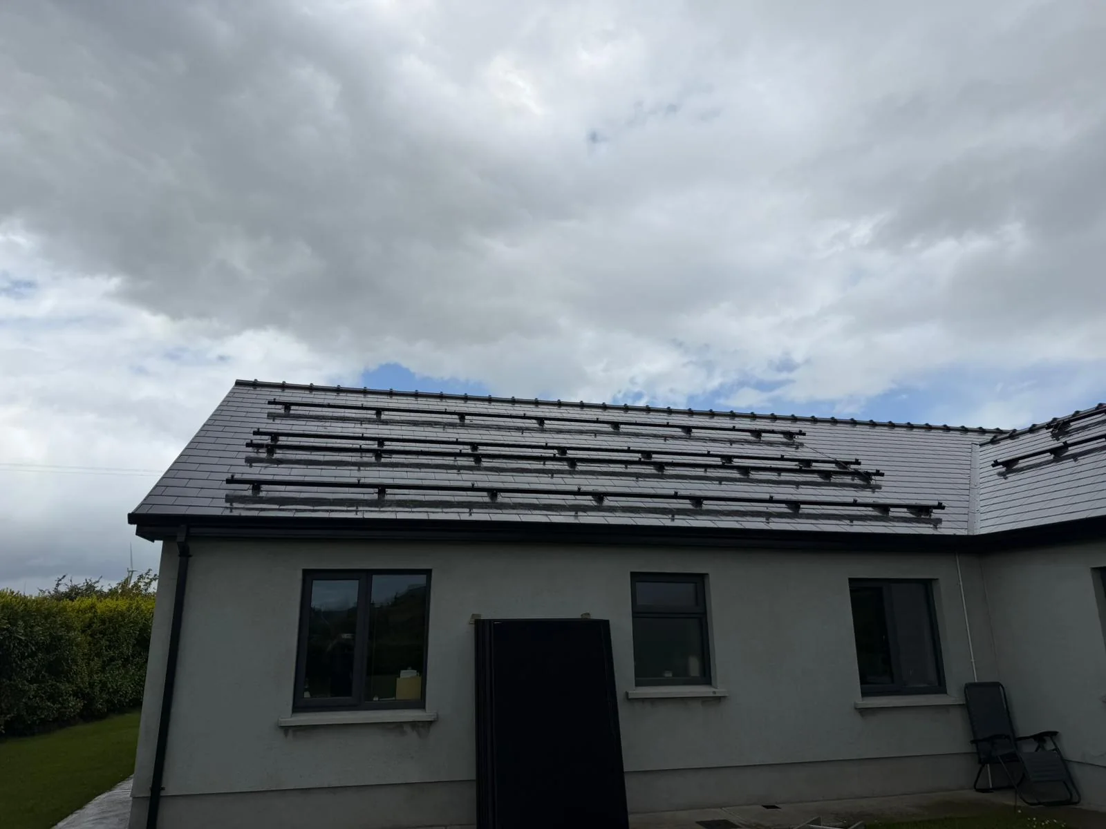 Solar PV mounting rails fixed to a slate roof
